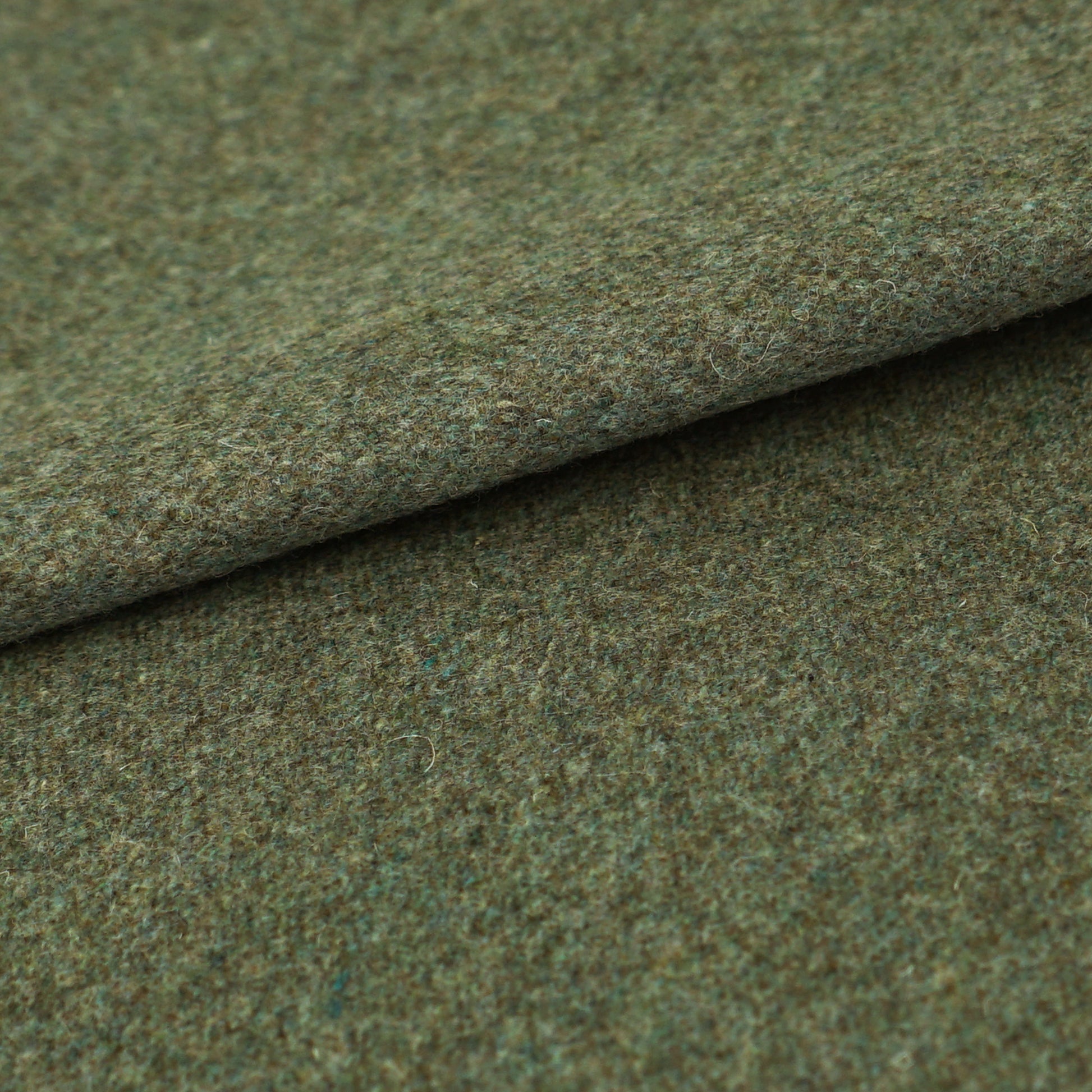Olive-green wool fabric with a soft, fuzzy texture and folded edge.