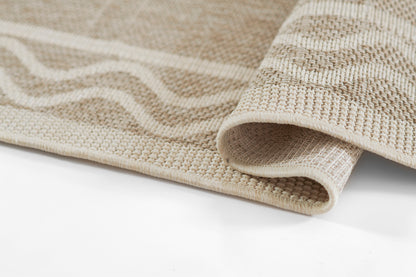 Beige woven rug with cream wavy stripe pattern and folded edge.