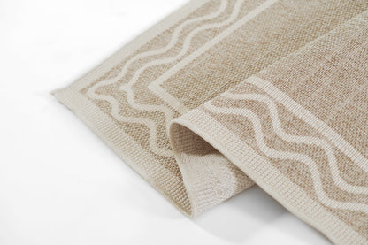 Beige and cream woven rug with cream wavy border, rectangular shape, rolled edge, natural-fiber texture.