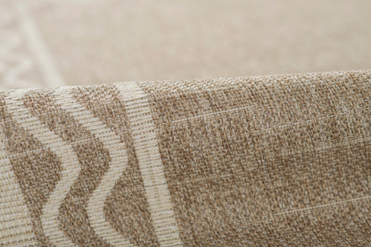 Beige & gray woven rug with chevron border and textured fabric.