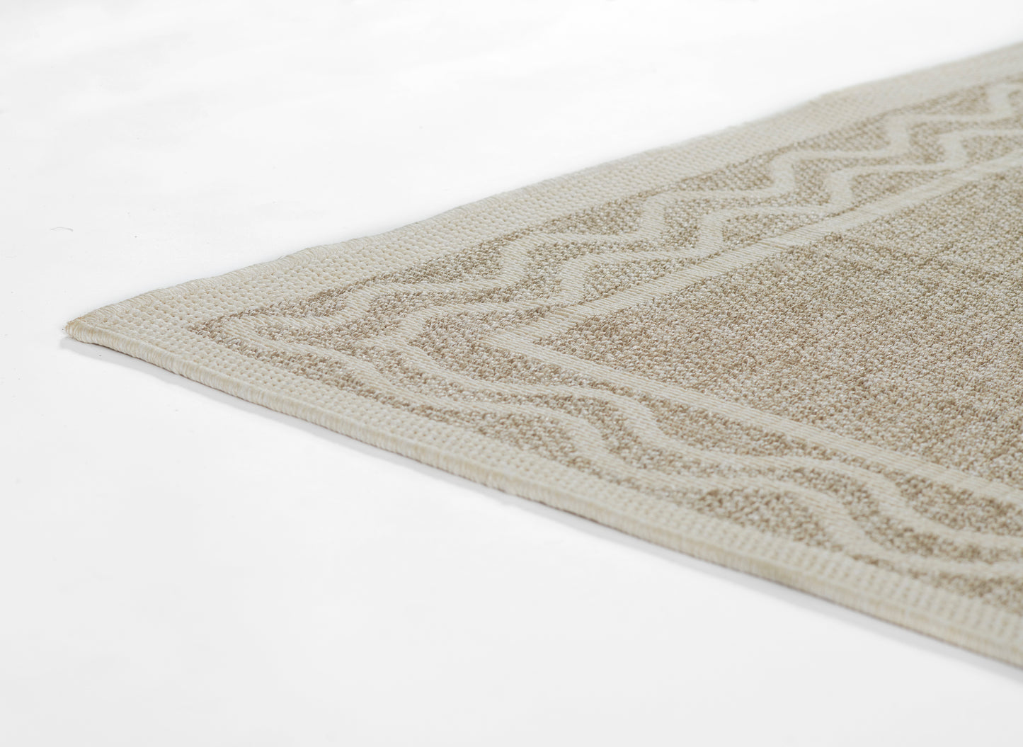 Beige-gray woven rug with chevron border pattern, low-pile texture and bound edges.