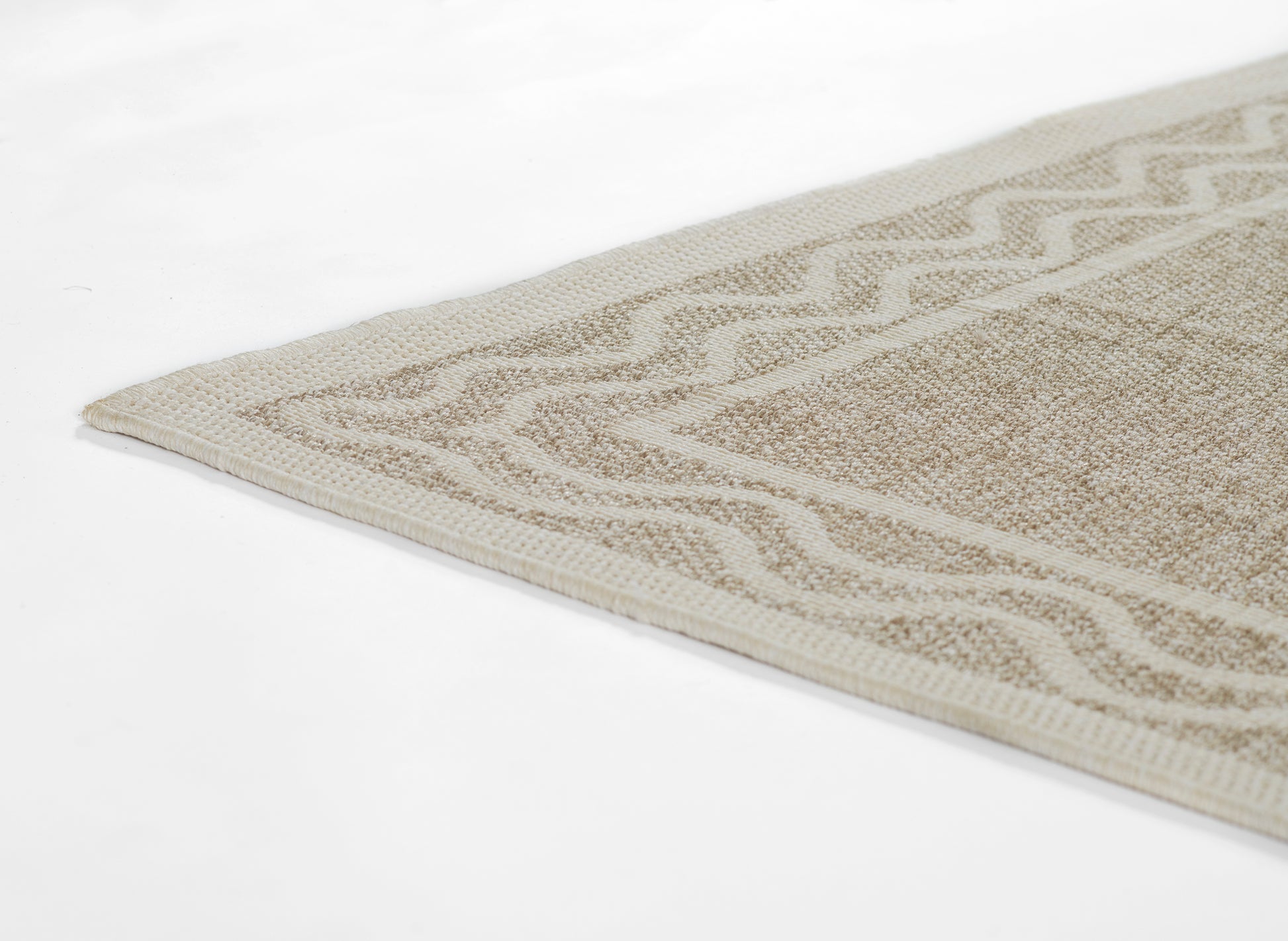 Rectangular beige-gray woven rug with chevron border; textured cotton/jute look.