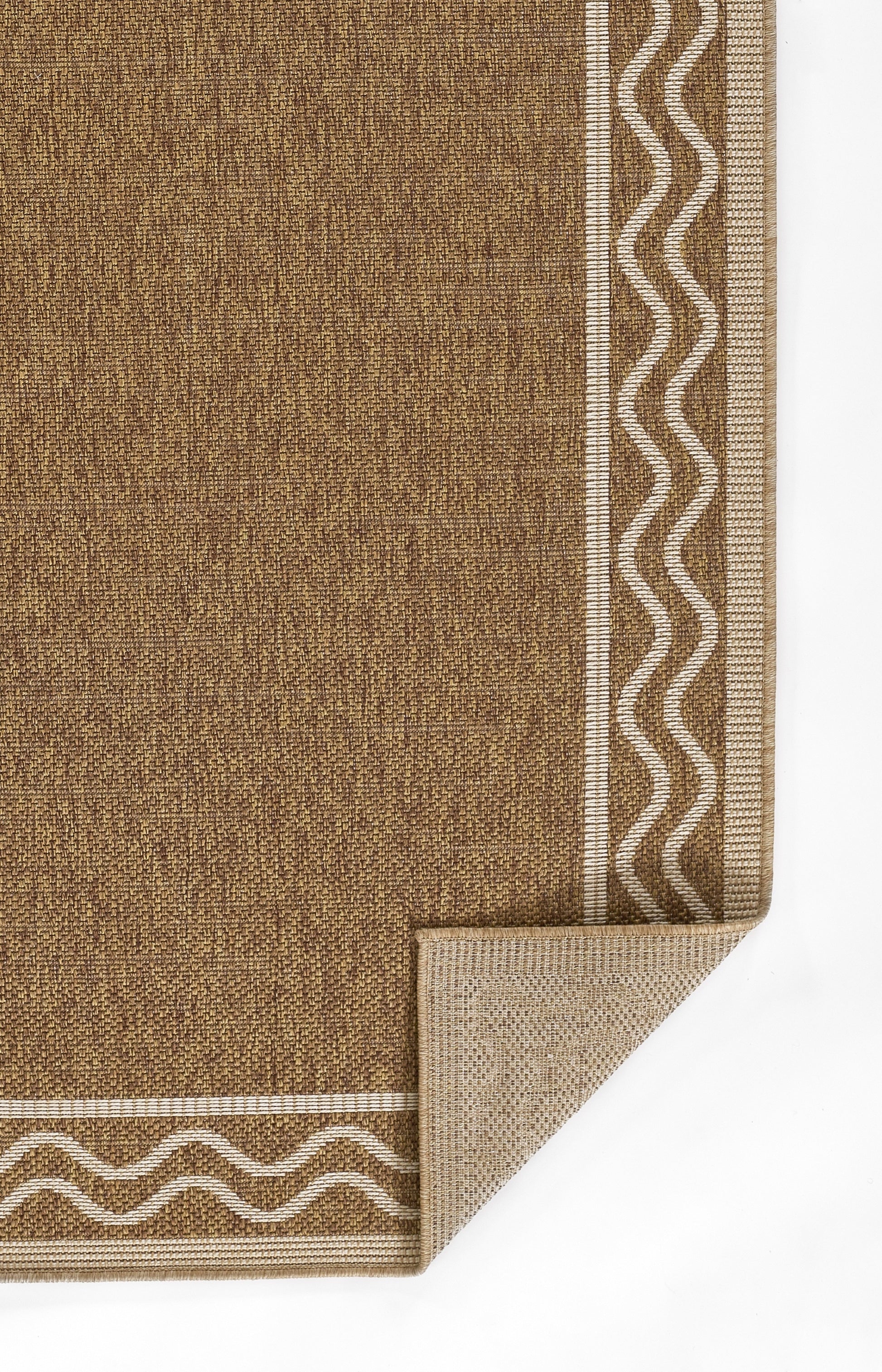 Natural brown jute rug with cream zigzag border; rectangular, rolled corner reveals beige underside.
