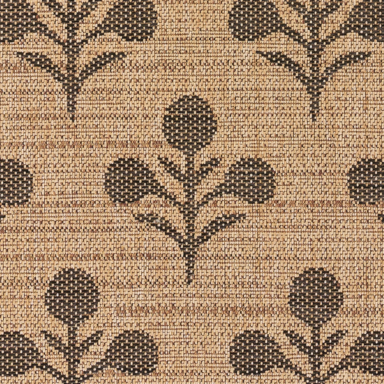 Beige woven rug with dark brown stylized floral motifs and stems.
