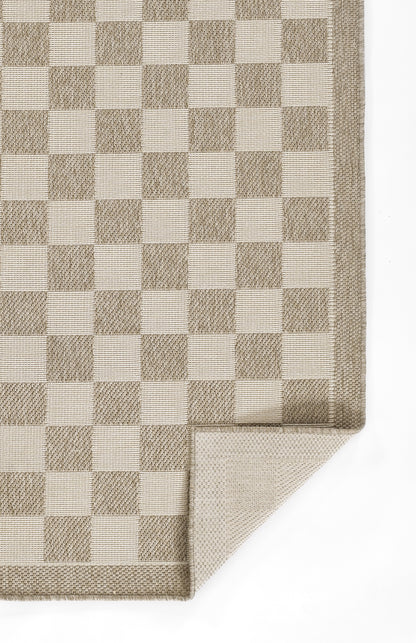 Beige and taupe checkerboard rug with a folded corner, woven textile for neutral home decor.