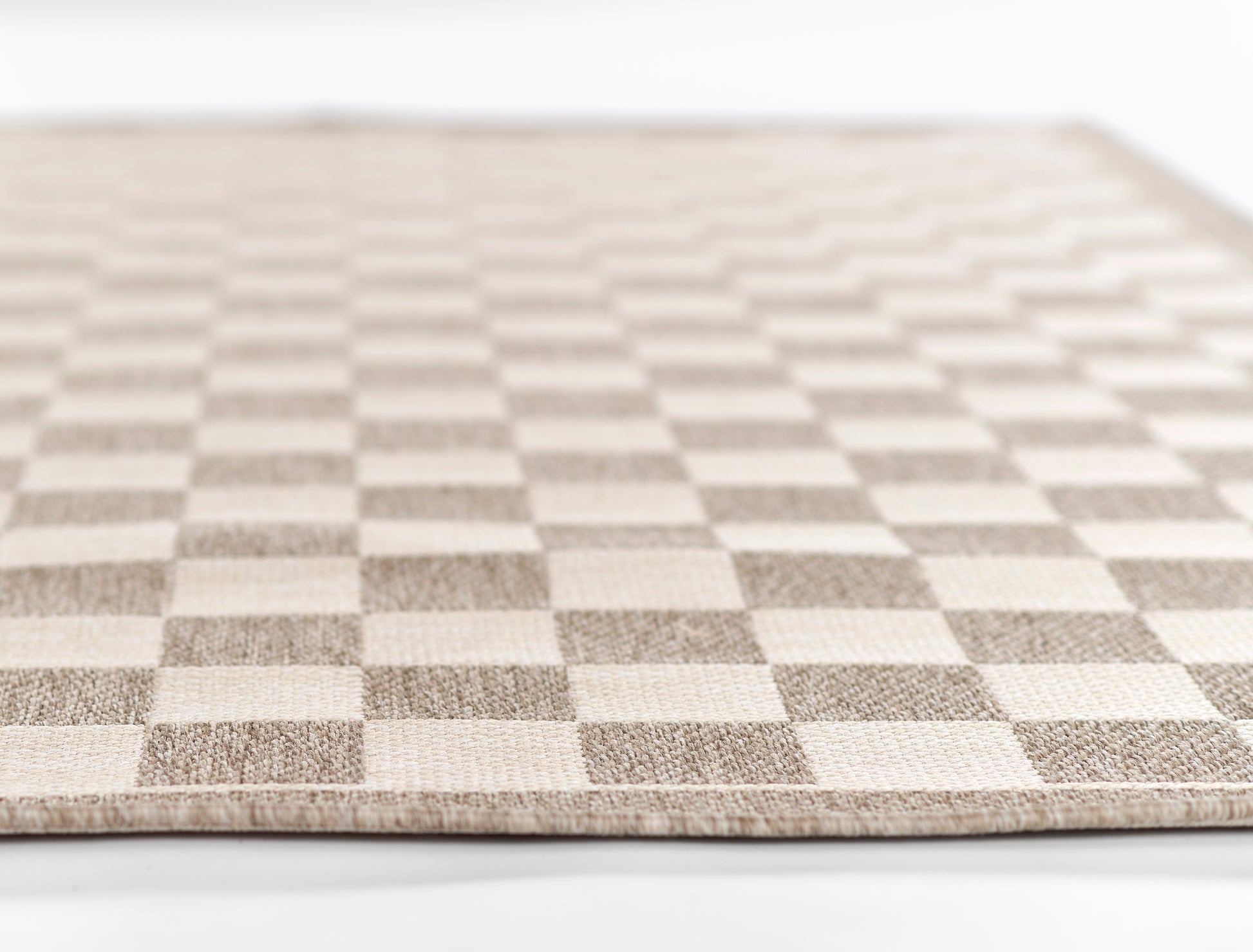 Beige and taupe checkerboard flat-weave rug; rectangular modern decor for living room.