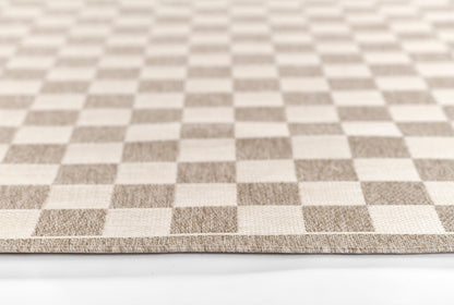 Beige and cream checkerboard rug sample with a low-pile texture.