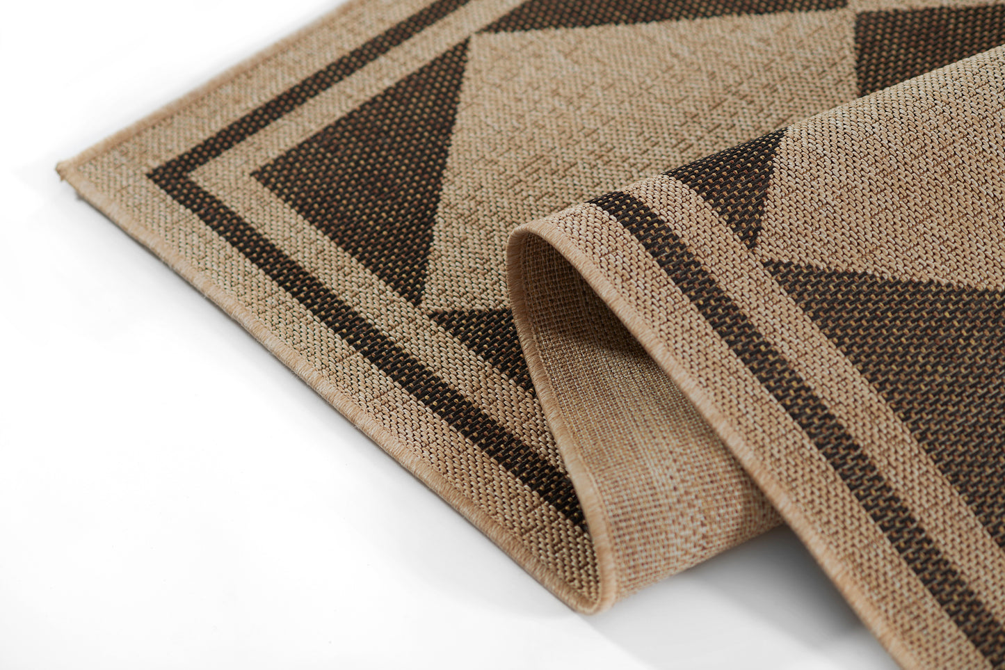 Beige and dark brown woven geometric rug with triangle patterns, natural fiber texture, folded edge.