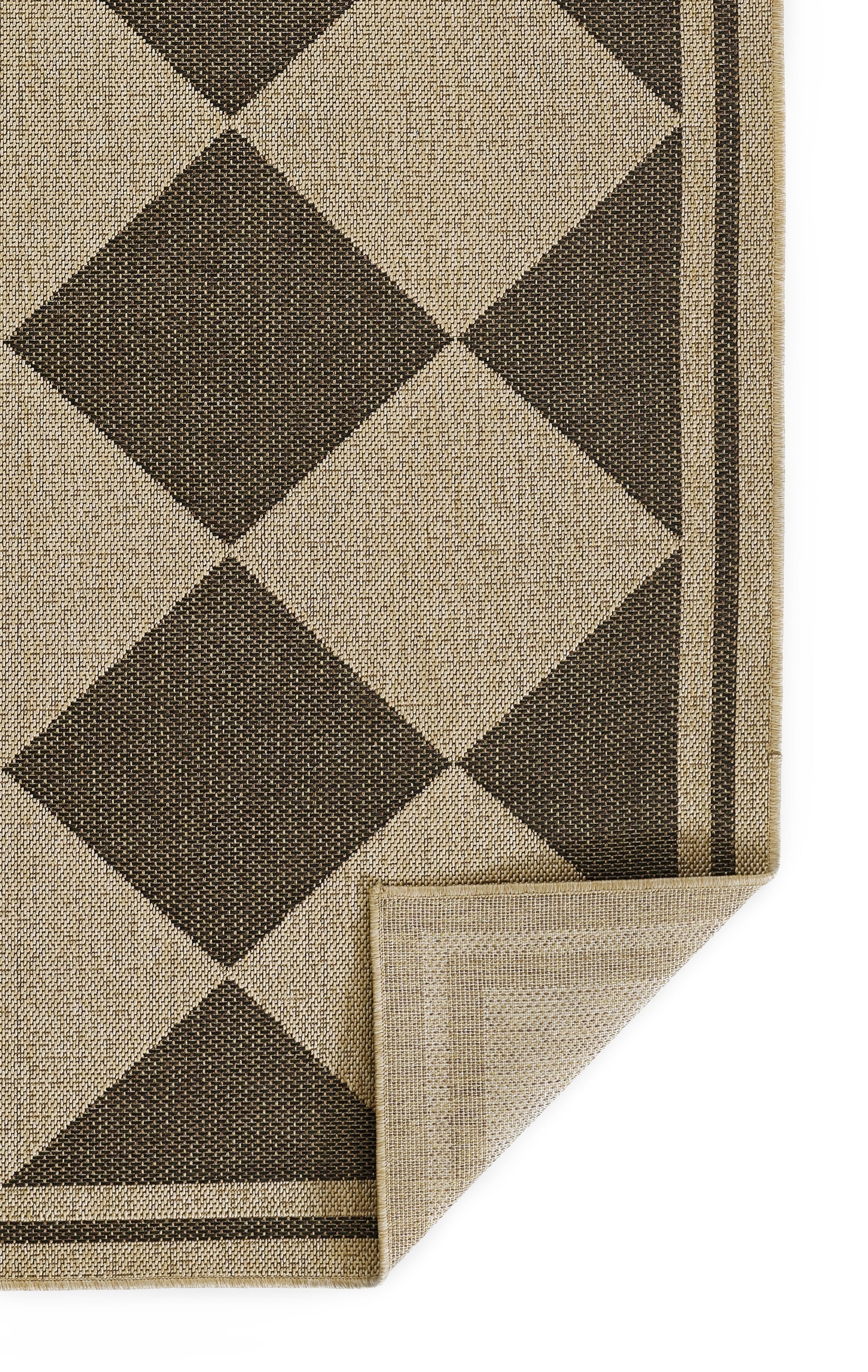 Beige and dark brown diamond Argyle rug with striped border; corner folded to reveal light beige underside.