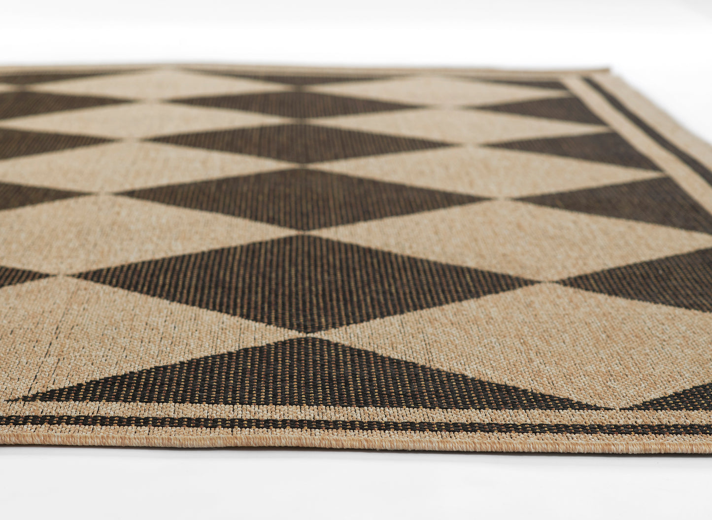 Rectangular woven rug in natural beige with black diamond pattern; geometric, natural fiber texture, ideal as an area rug.