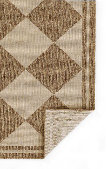 Beige woven rug with large brown diamond pattern & striped border; corner folded back.