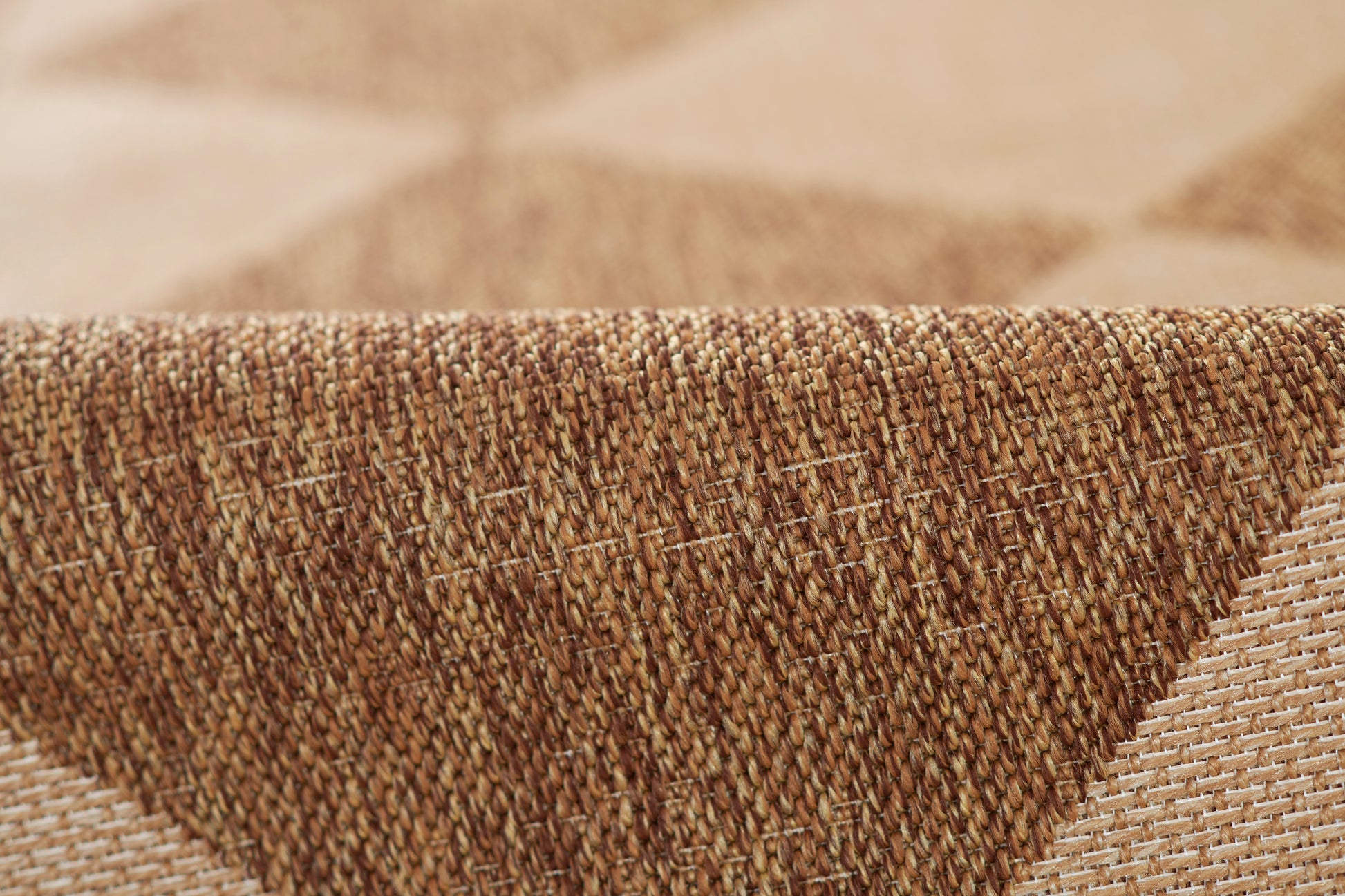 Natural brown woven rug with textured fibers and tan beige checker pattern; rustic floor decor.