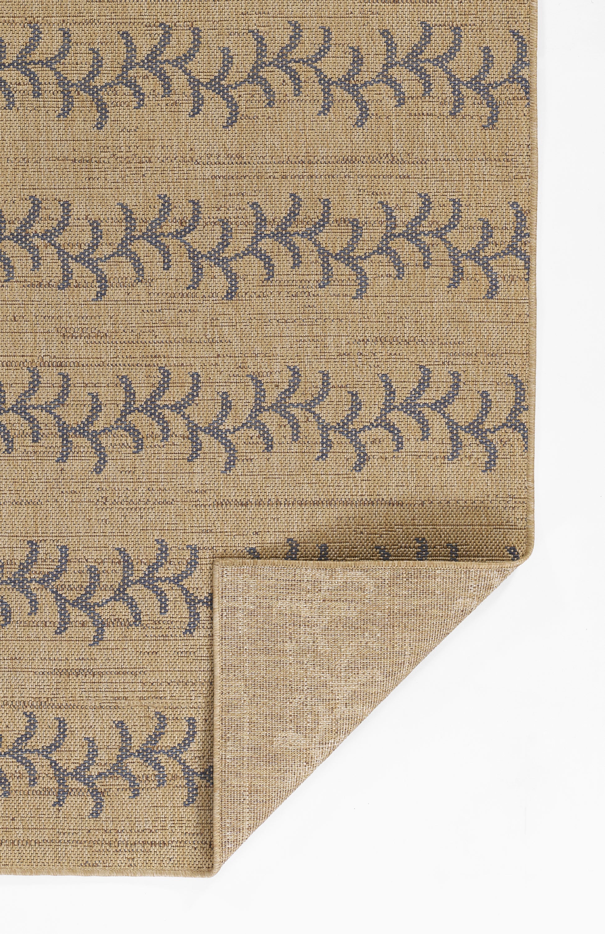 Beige woven rug with blue leafy vine stripe; natural jute texture, rectangular with folded corner.
