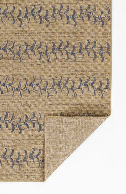 Beige natural-fiber rug with blue leafy pattern; rectangular, woven texture, casual boho style; folded corner visible.