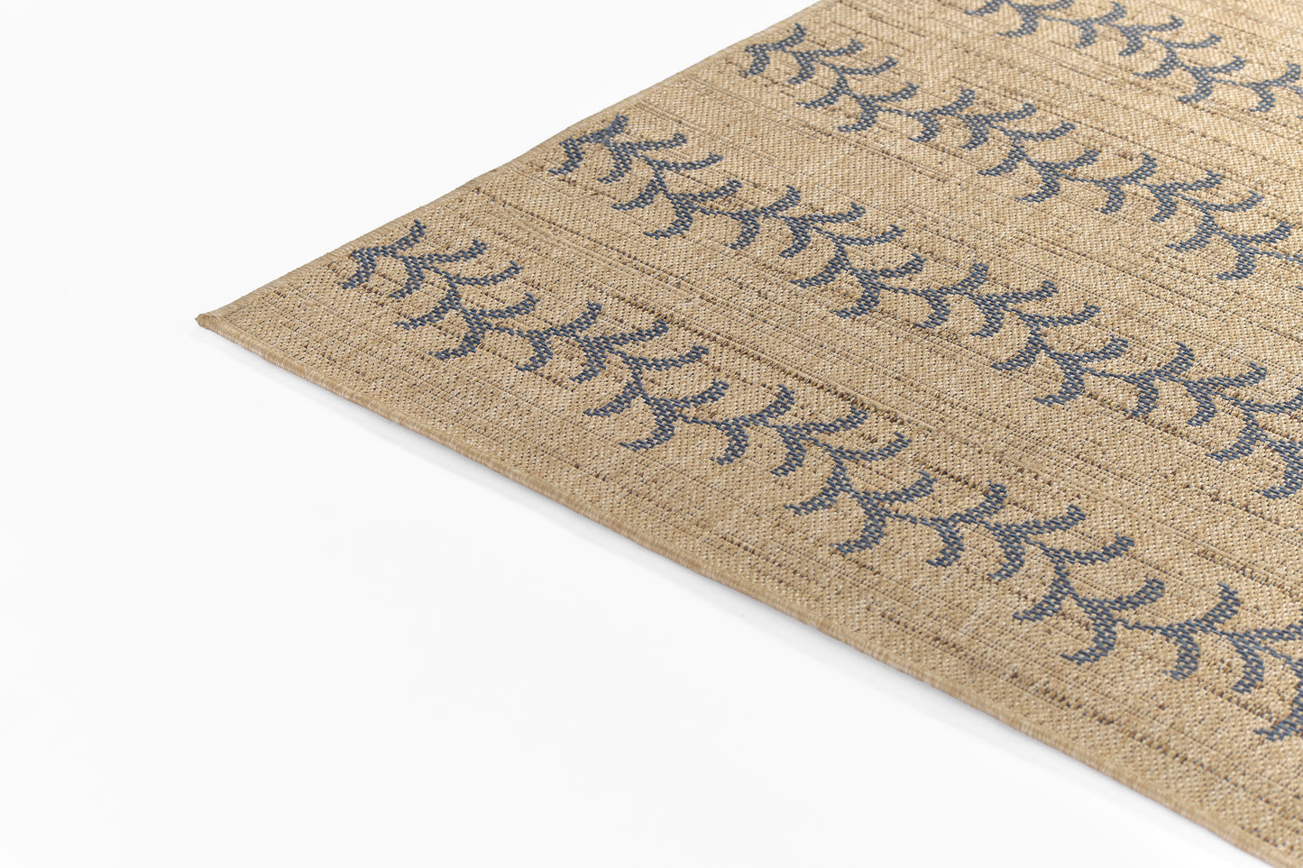 Natural jute rug with blue leaf pattern, rectangular woven floor decor in a coastal boho style.