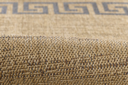 Beige natural-fiber woven rug with blue Greek-key border; textured, rolled edge.
