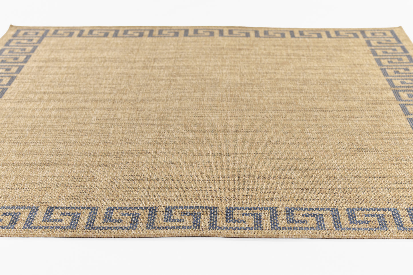 Natural jute rug with a blue Greek-key border, rectangular woven area rug.