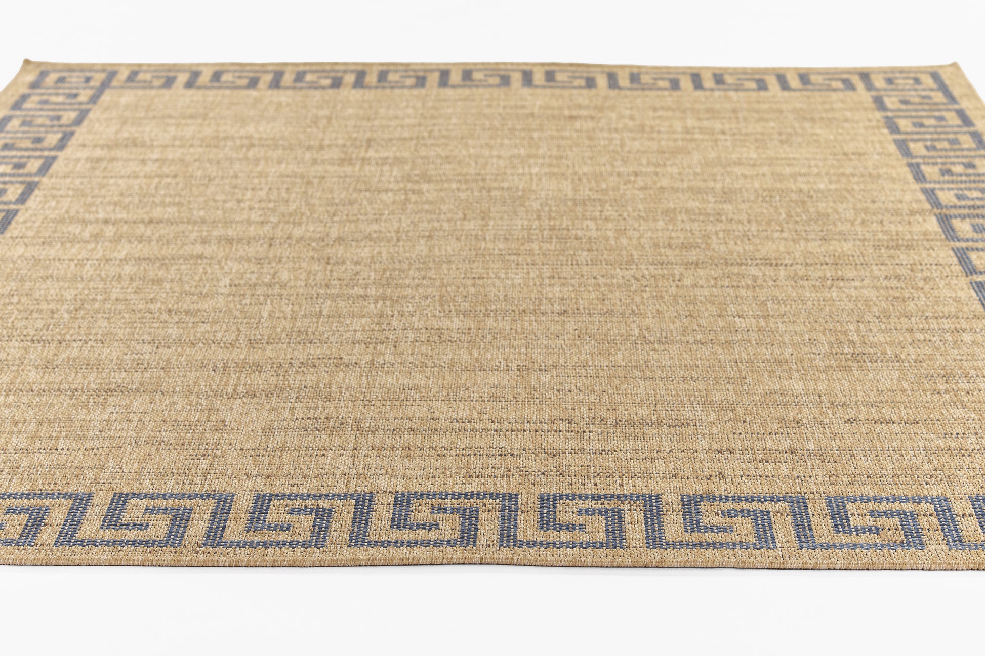 Natural jute rug with a blue Greek-key border, rectangular woven area rug.