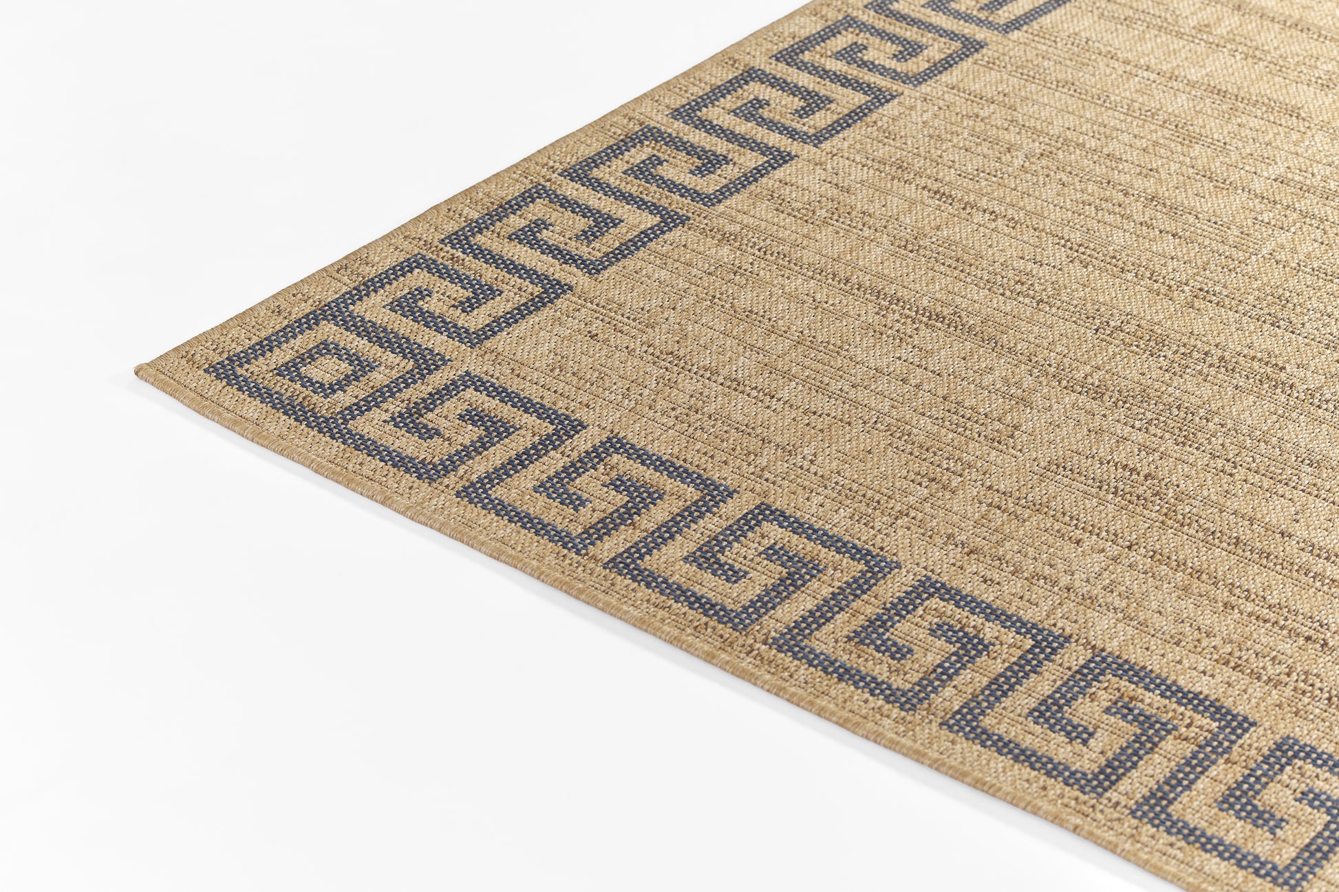 Beige jute rug with blue Greek-key border along the edge; rectangular with natural textured surface.