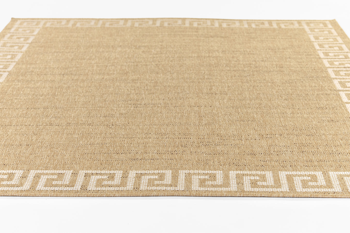 Beige woven jute rug with white Greek key border; natural texture, rectangular floor accent.