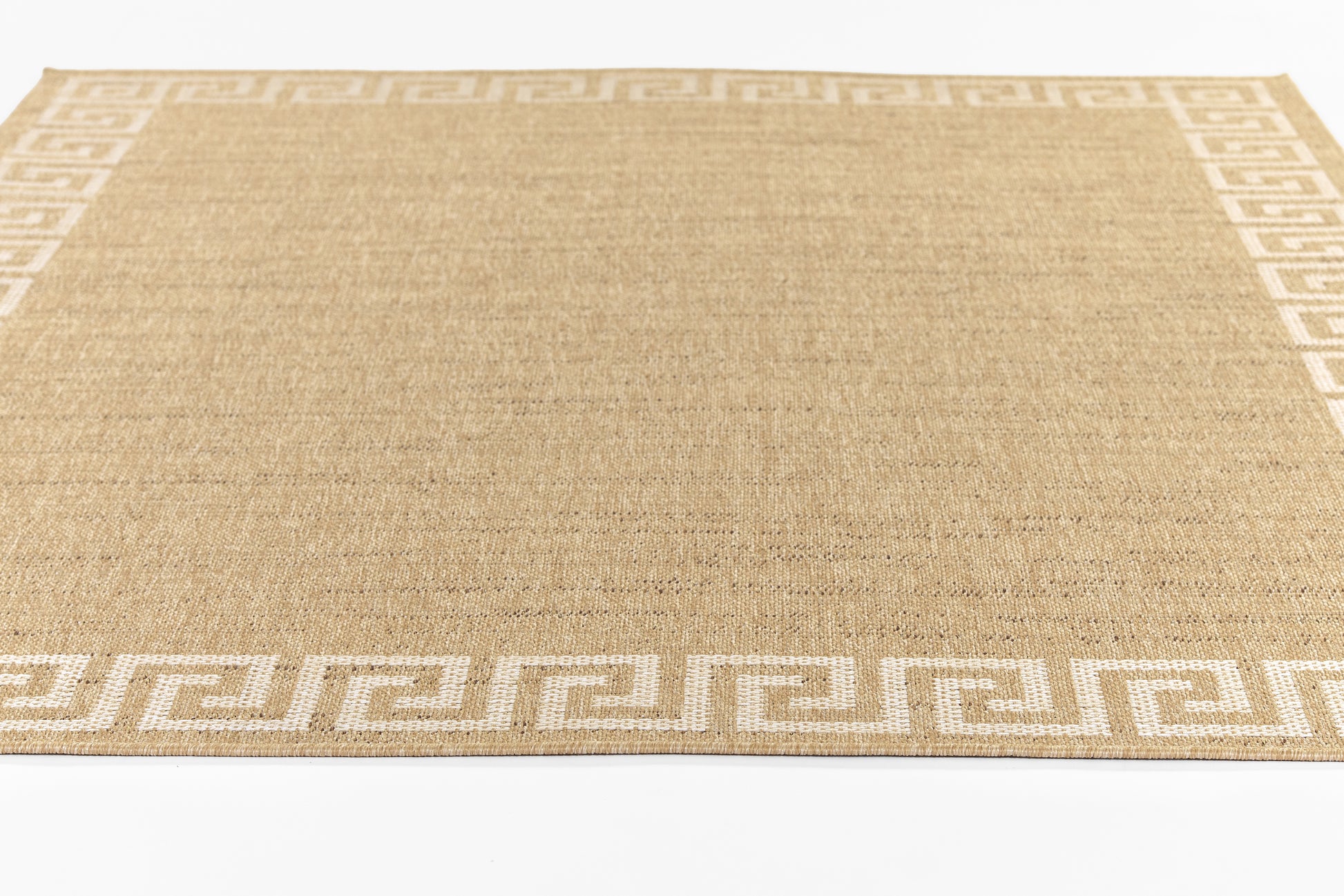 Natural beige woven jute rug, rectangular, with white Greek-key border along edges.