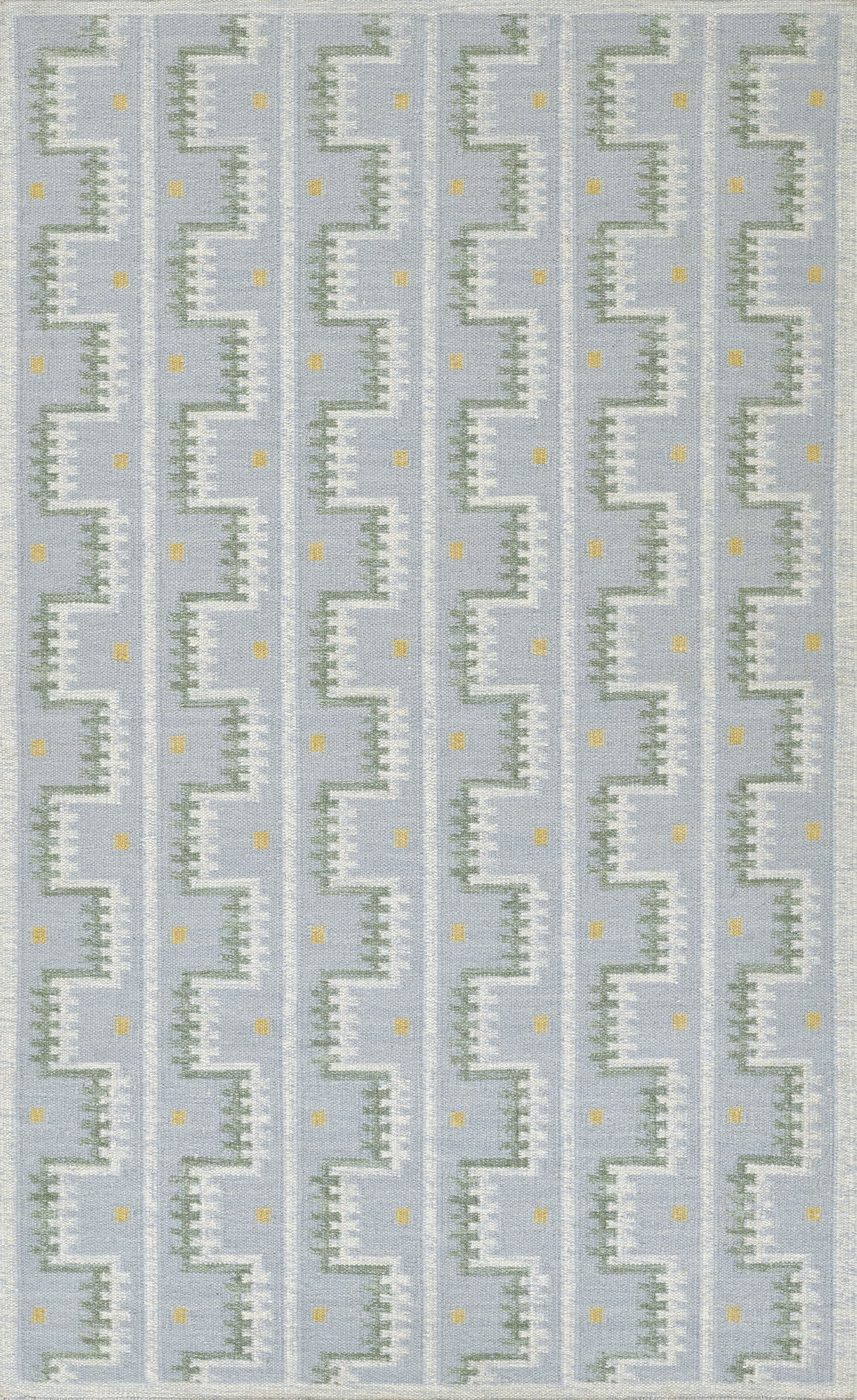 Scandinavian blue geometric rug with white zigzag stair-step motif and tiny yellow dots in vertical repeats.