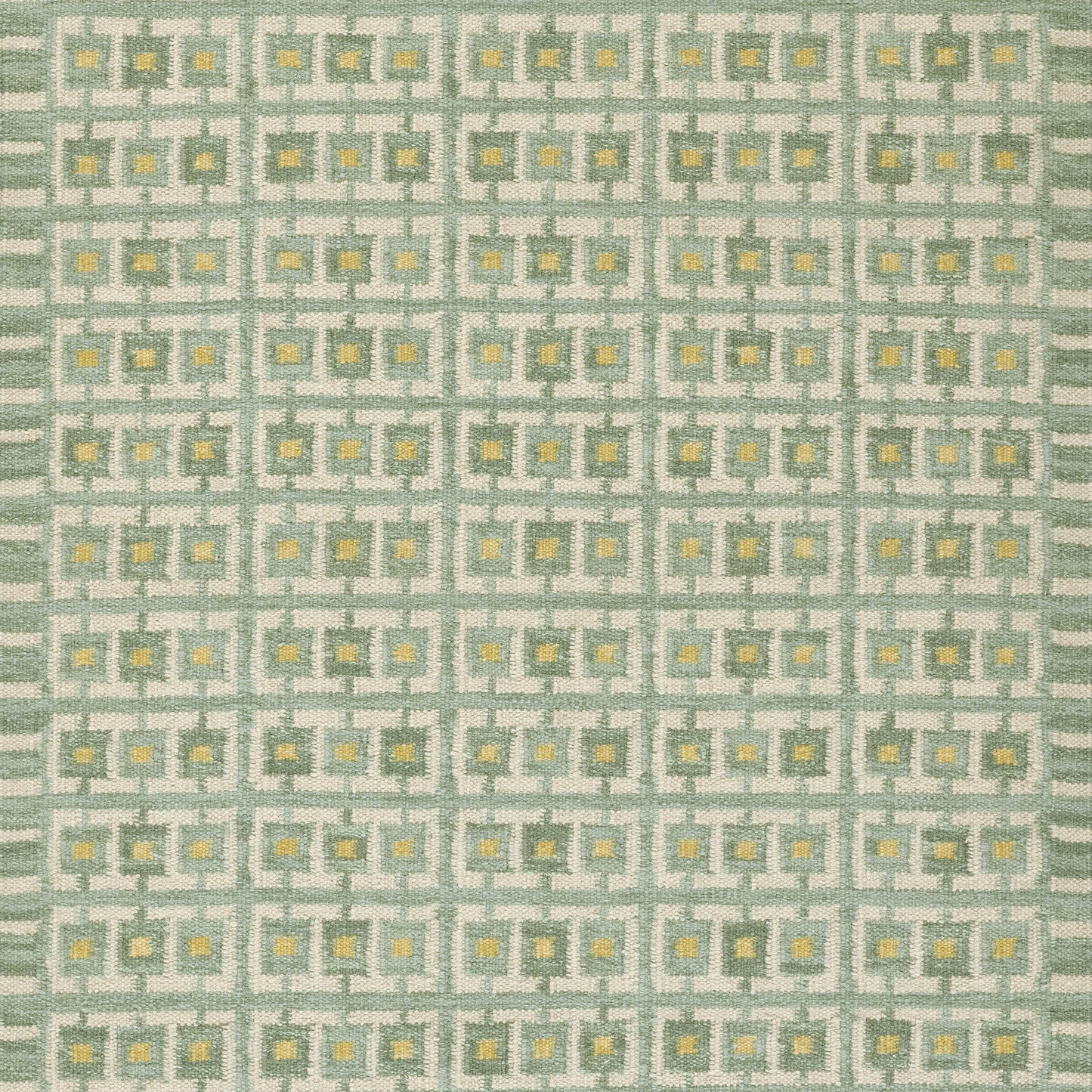 Mint-green rug with a repeating gray square-grid pattern and tiny yellow centers; Scandinavian-inspired geometric rug.