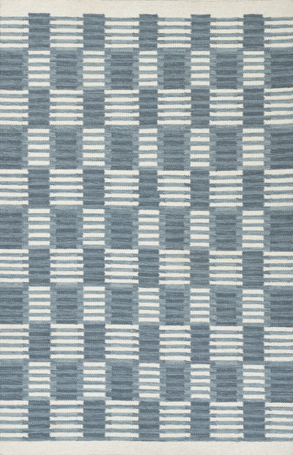 Scandinavian-inspired blue woven rug with navy and light-blue checker/grid pattern, geometric floor decor.