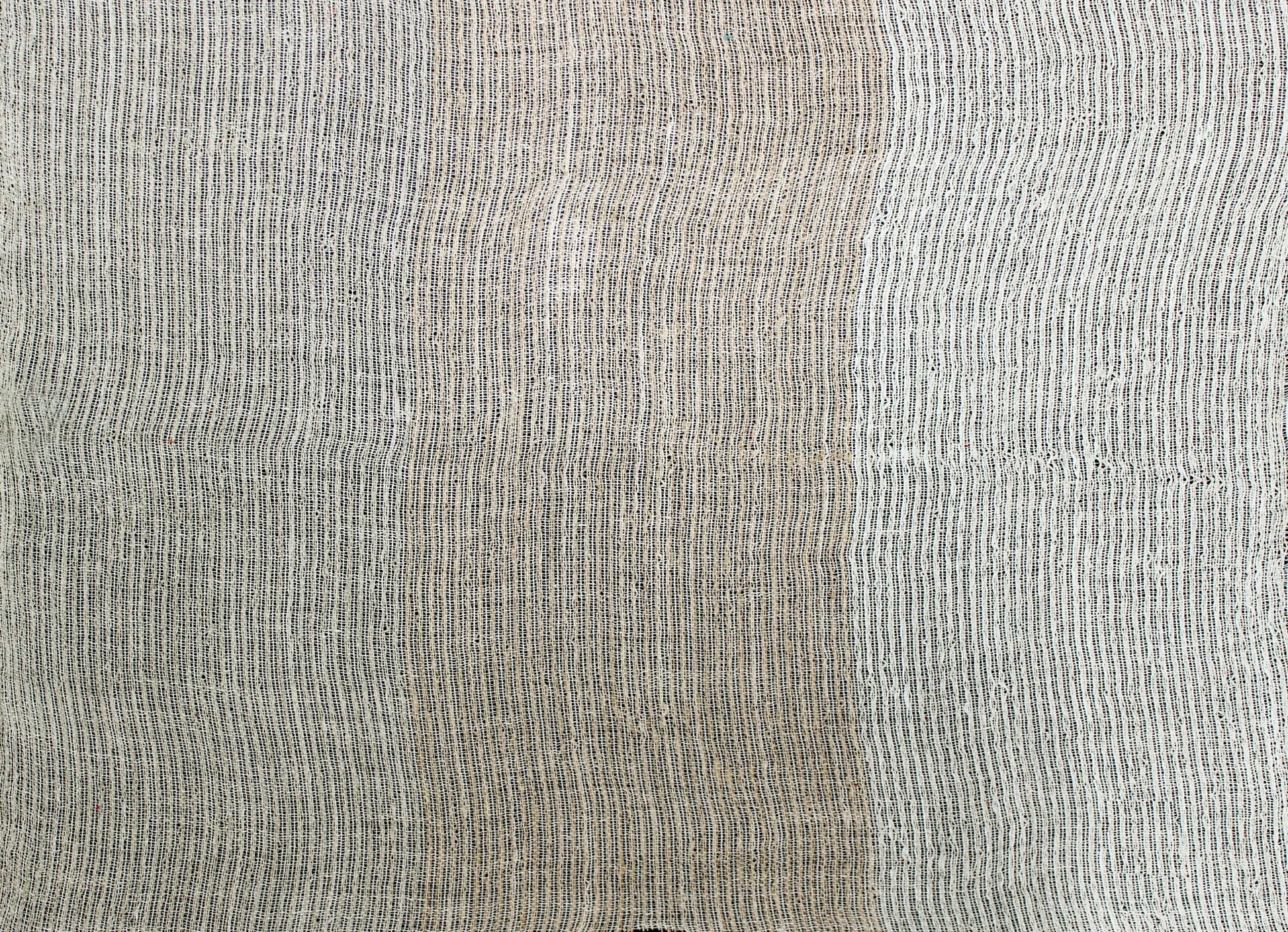 Beige woven fabric swatch with fine vertical dark stripes; linen-like texture.