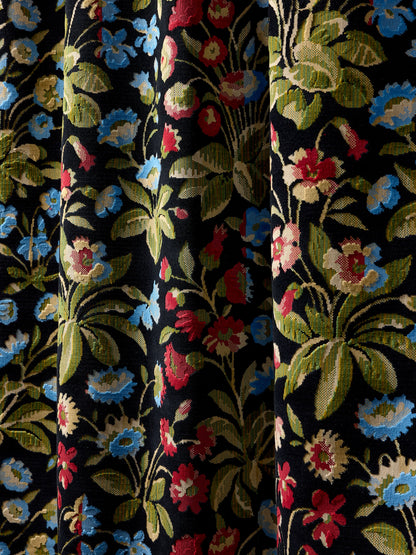 Dark floral tapestry fabric with blue, red, pink flowers and green leaves, draped with soft folds