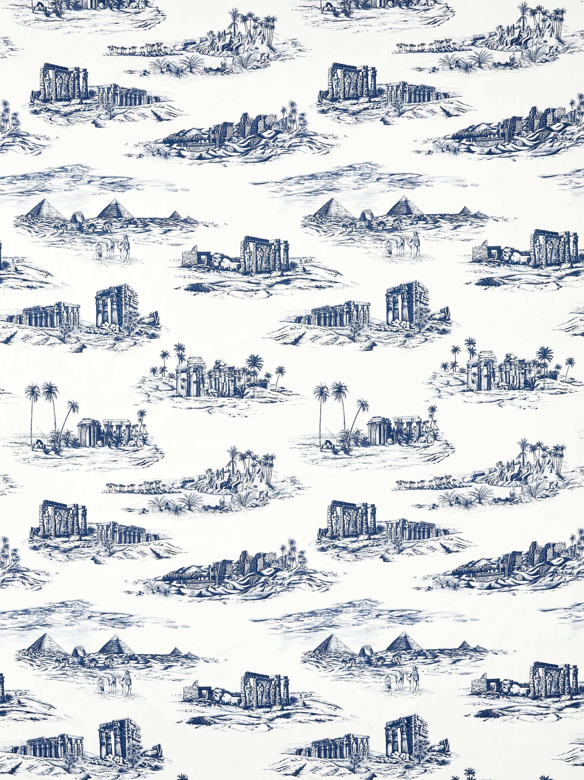 Blue toile-style print of pyramids, temples, ruins, and palm trees on white with repeating island scenes.