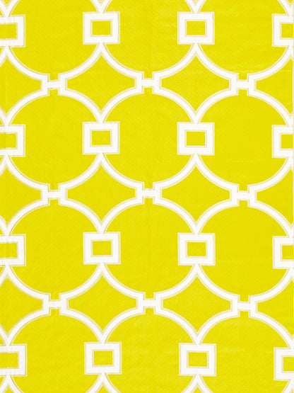 Bright yellow fabric with bold white interlocking circle/quatrefoil lattice and small square accents.