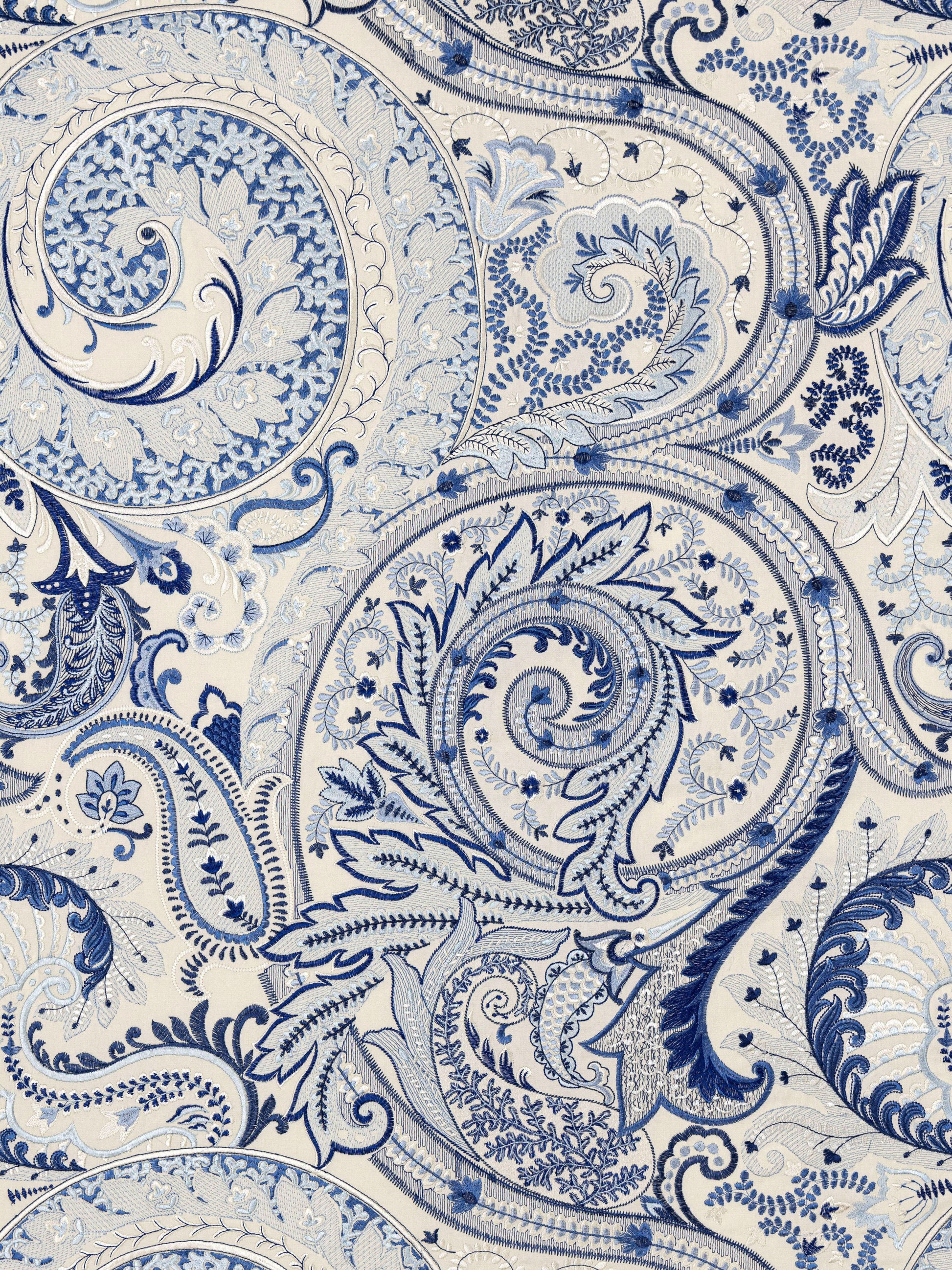Blue and white paisley floral damask fabric pattern with ornate scrollwork.