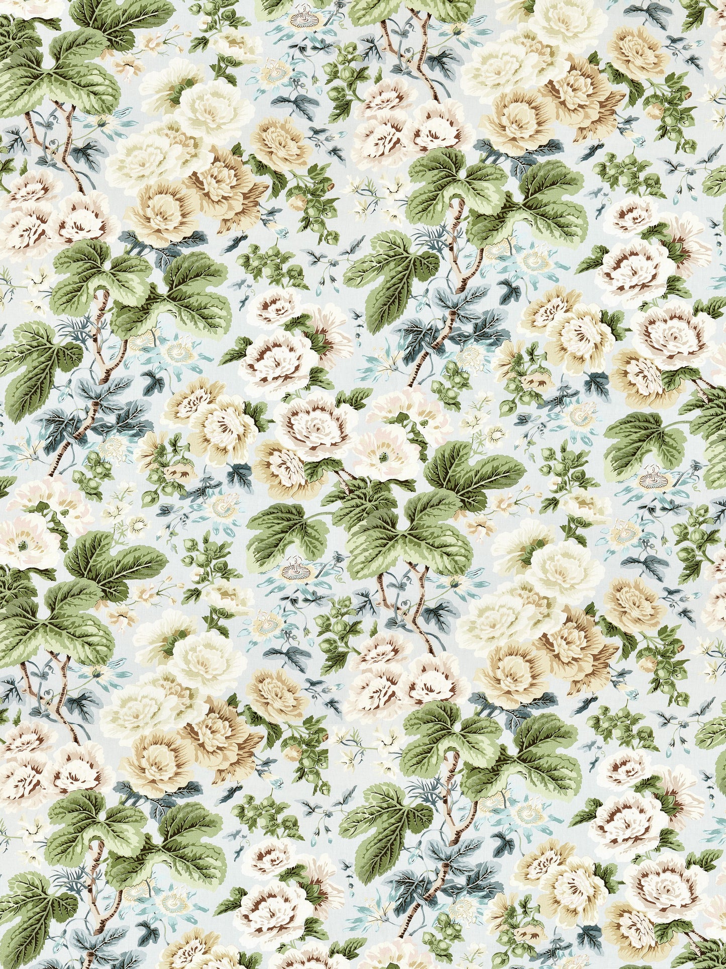 Floral linen print fabric pattern with cream and yellow roses and large green leaves on a light blue background.