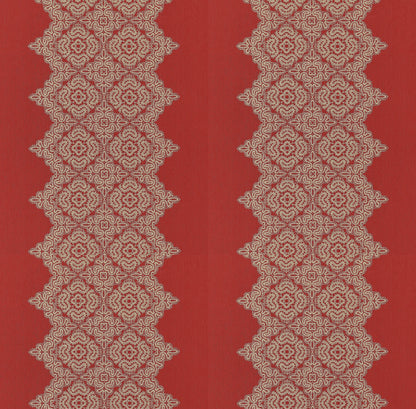 Red fabric with cream lace-like diamond lattice patterns forming two vertical columns.