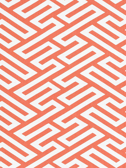 Coral orange Canton fret applique fabric with a white interlocking square maze pattern; bold, modern print.