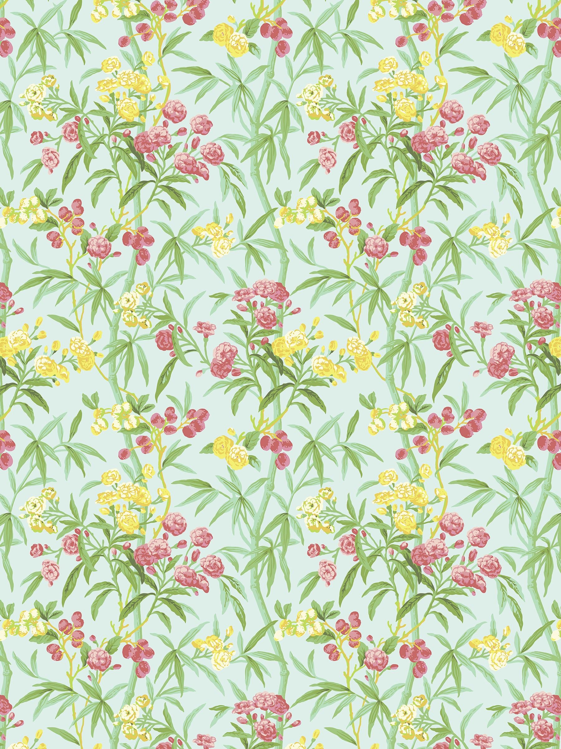 Pastel mint-green fabric with yellow and pink flowers and green leafy vines in a repeating botanical pattern.