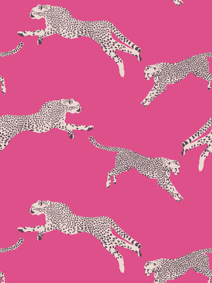 Bright pink background with repeating white leopard print and black spots for fashion fabric or wallpaper.