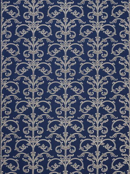 Navy wallpaper featuring repeating silver damask scrollwork vines and floral accents in a vintage pattern.