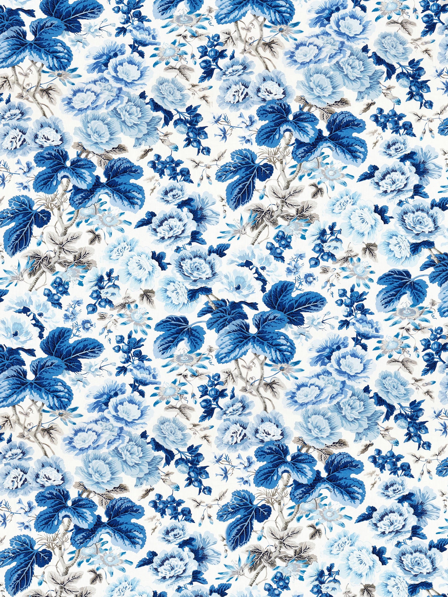 Blue floral print with cobalt and sky-blue roses and leaves on ivory background; vintage textile pattern.