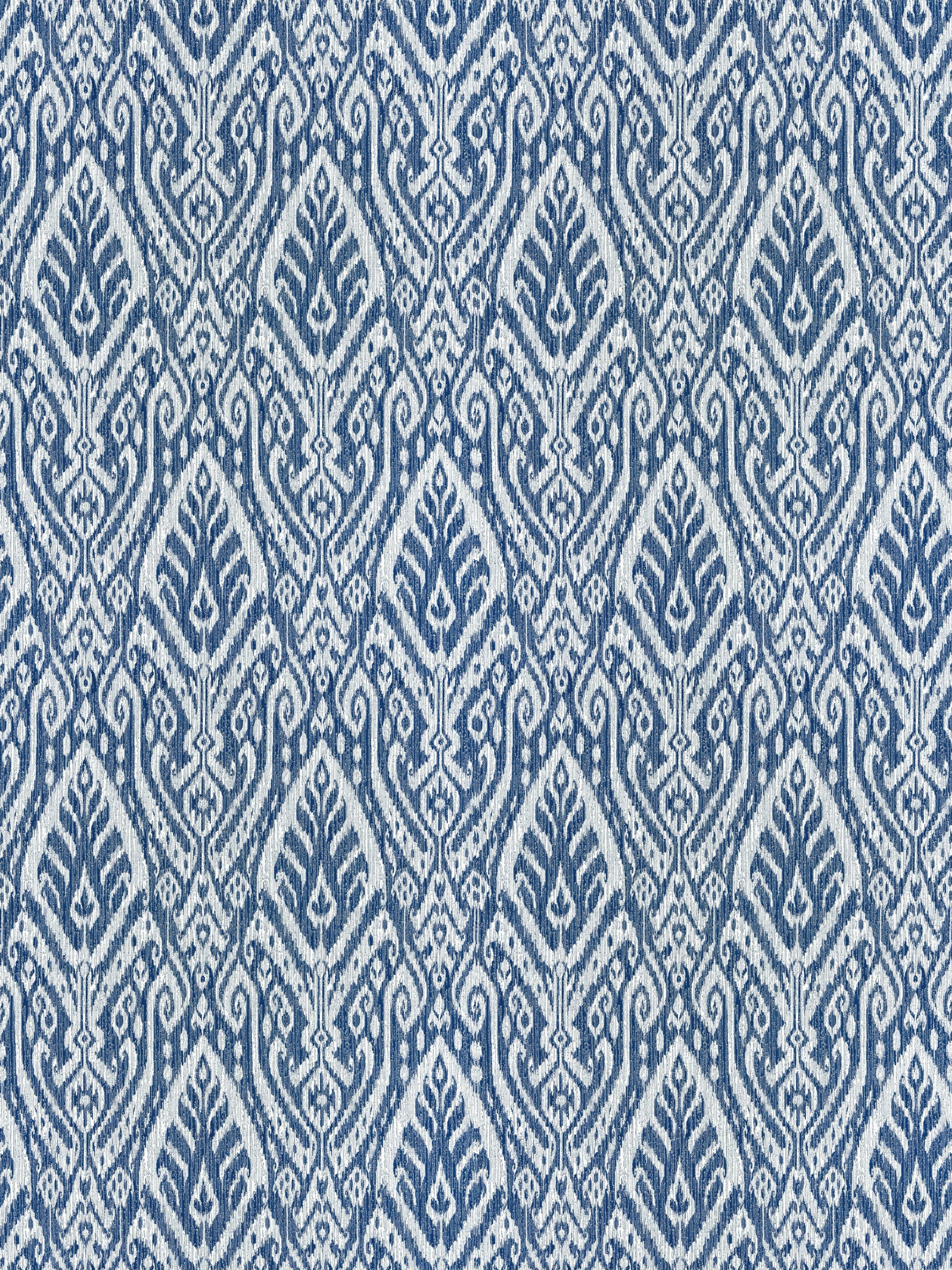 Blue & white ikat-inspired diamond pattern textile with leaf-like motifs; ideal for upholstery or curtains.