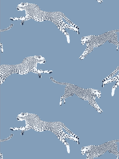 Blue background with white cheetah silhouettes in a leaping pattern; seamless decorative animal print.