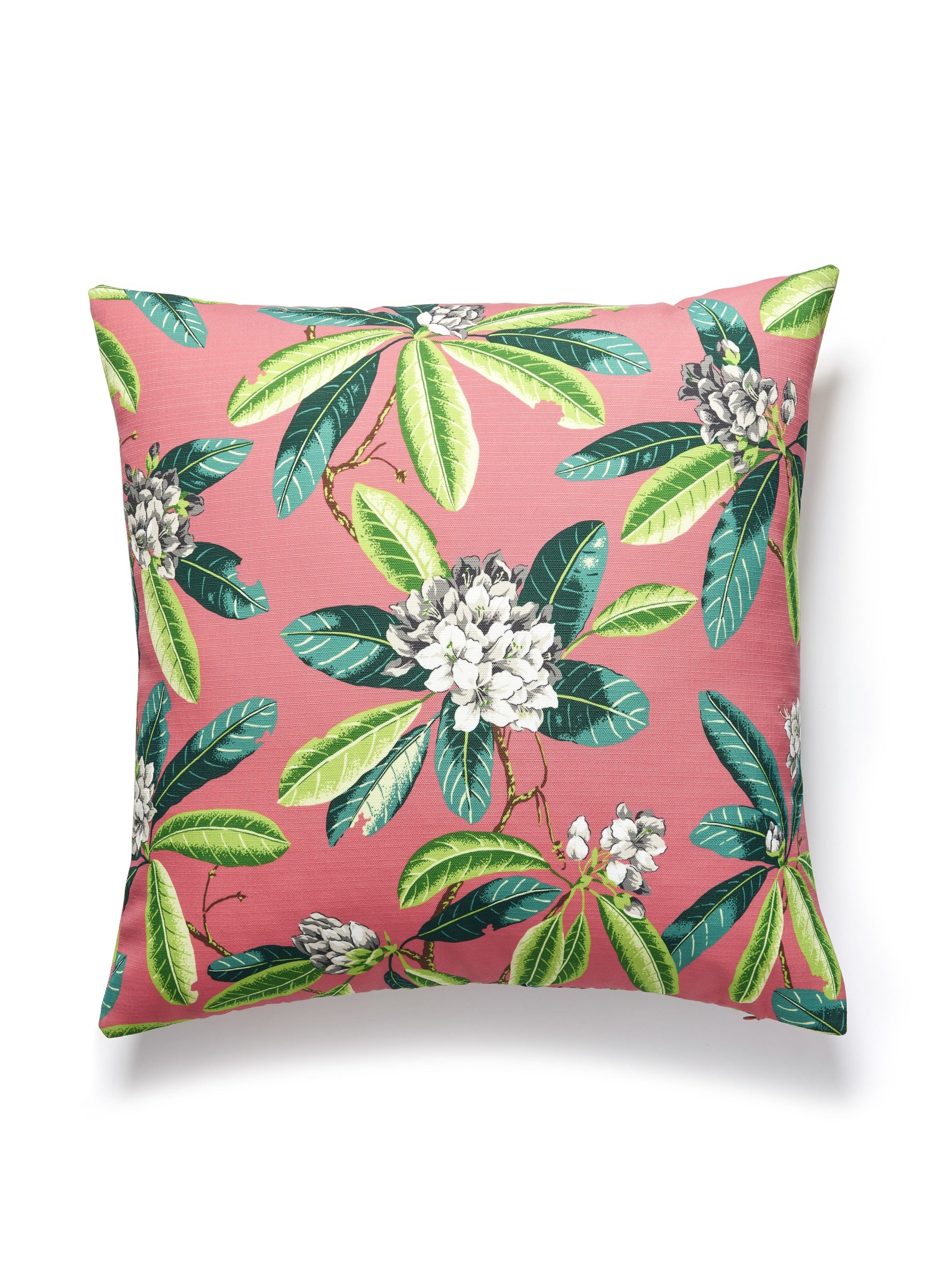 Pink square throw pillow with tropical green leaves and white floral clusters, botanical print, textile home decor.