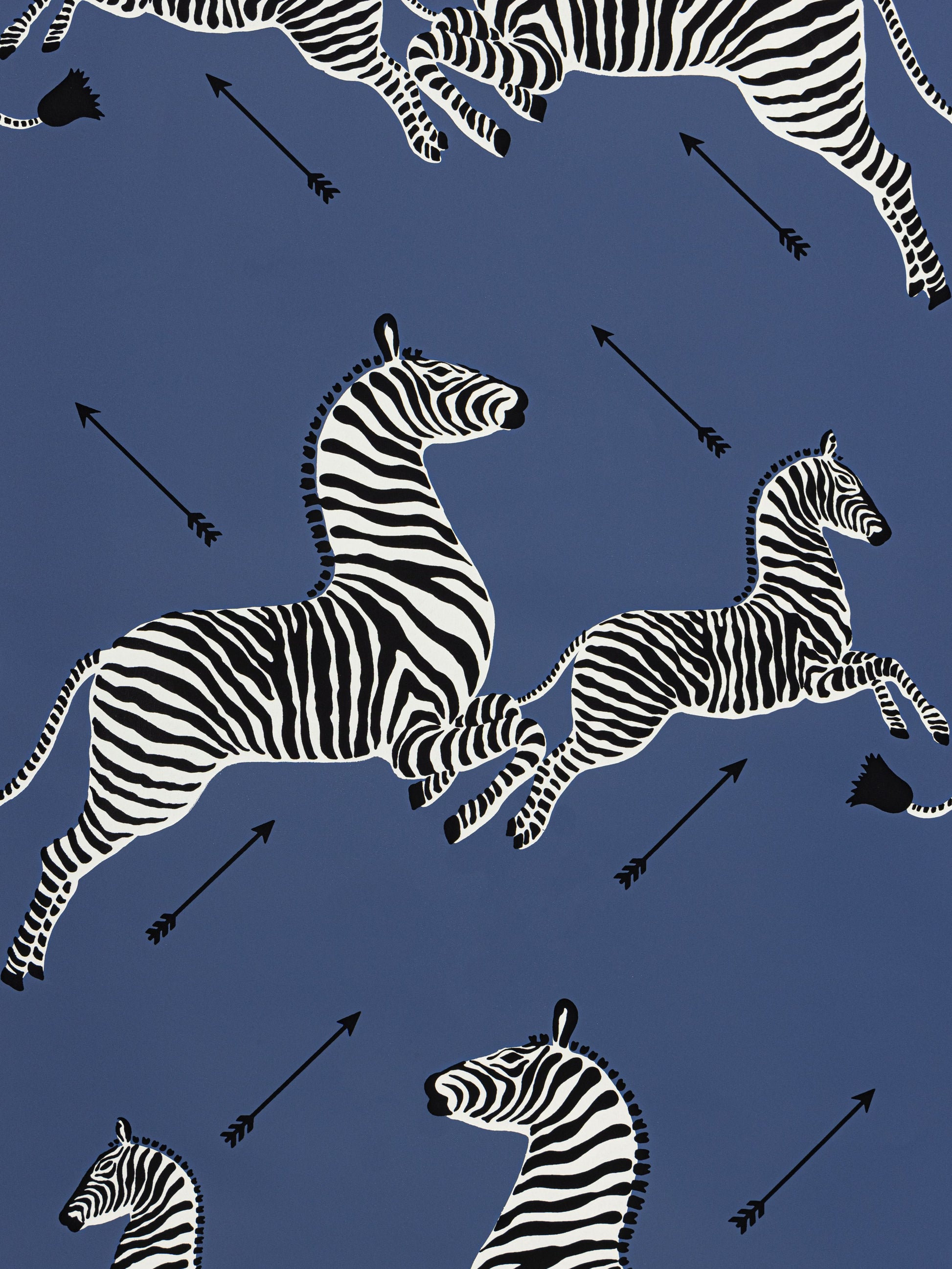 Blue background fabric with black-and-white zebra motifs in a bold repeating pattern.