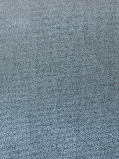 Close-up of azure blue woven fabric texture with a tight, soft weave, suitable for upholstery.