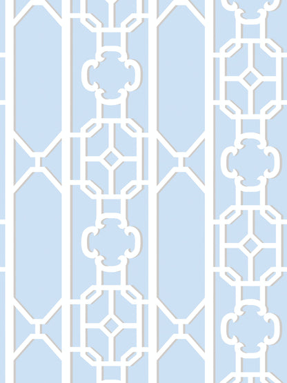 Powder blue ornamental lattice with scrolling fretwork on a decorative panel.