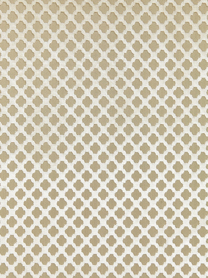 Beige fabric with a cream quatrefoil lattice pattern, repeating across the surface.