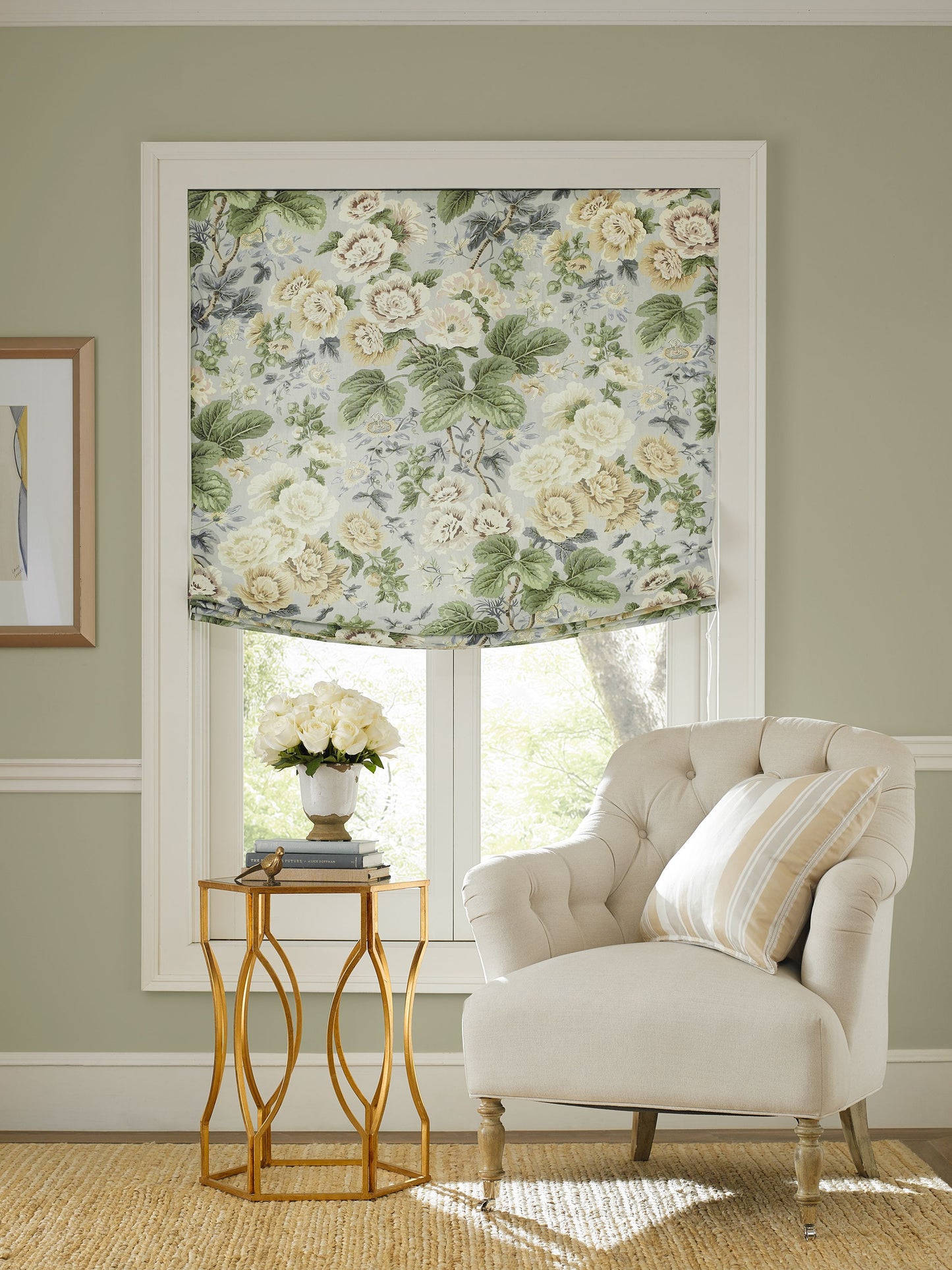Floral linen print fabric swatch for a window treatment, shown with a beige tufted armchair and a gold glass-top side table with white roses.