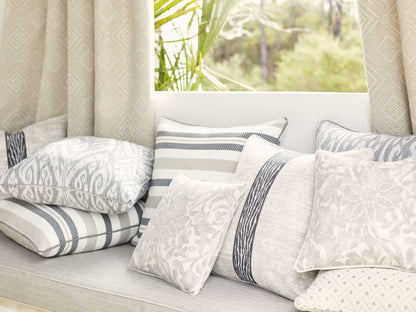Beige fabric swatch with gray & cream striped, damask & geometric patterns.