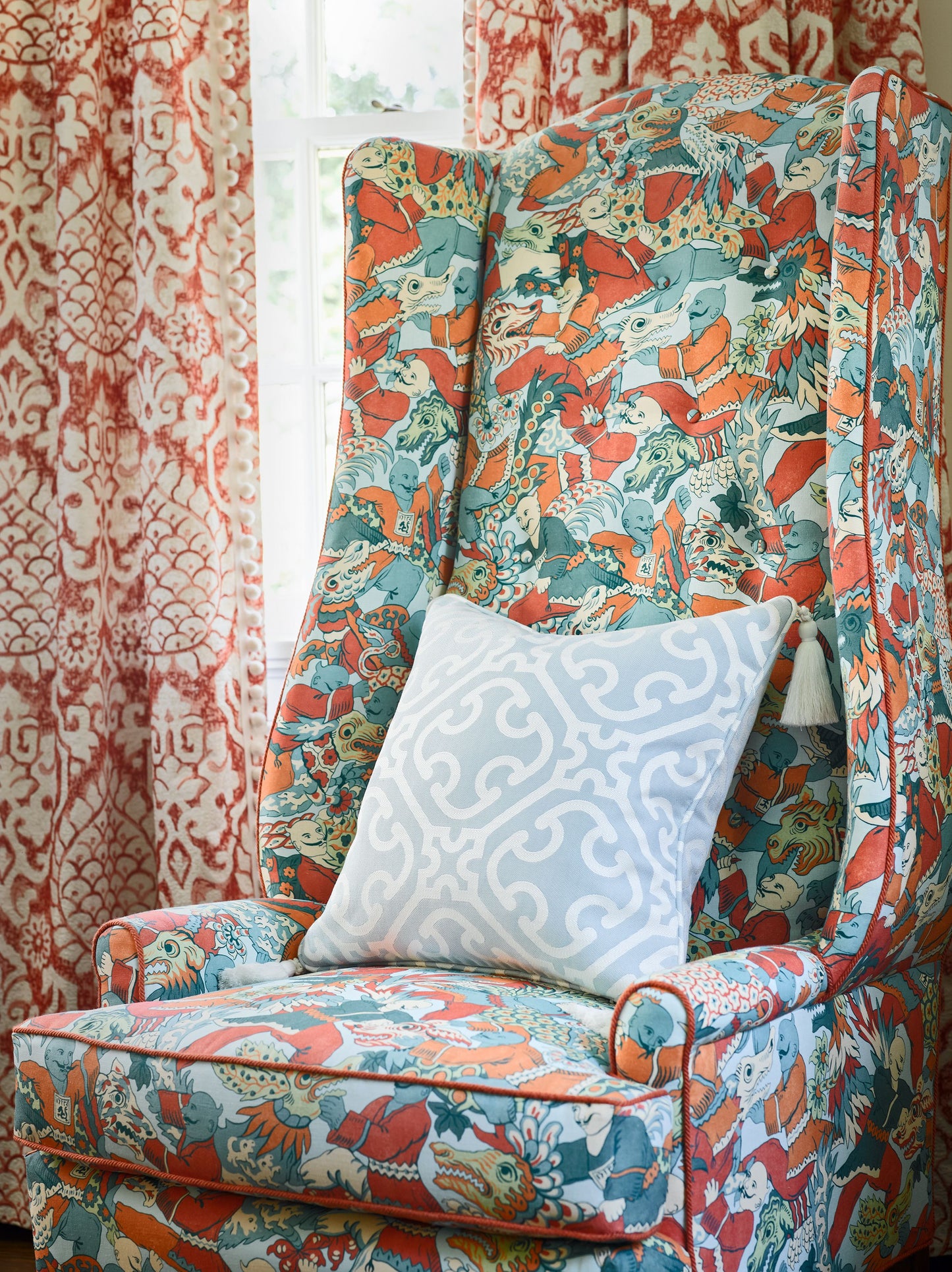 Linen lattice-weave fabric in teal, orange and red with a whimsical figure motif; light blue geometric accents.